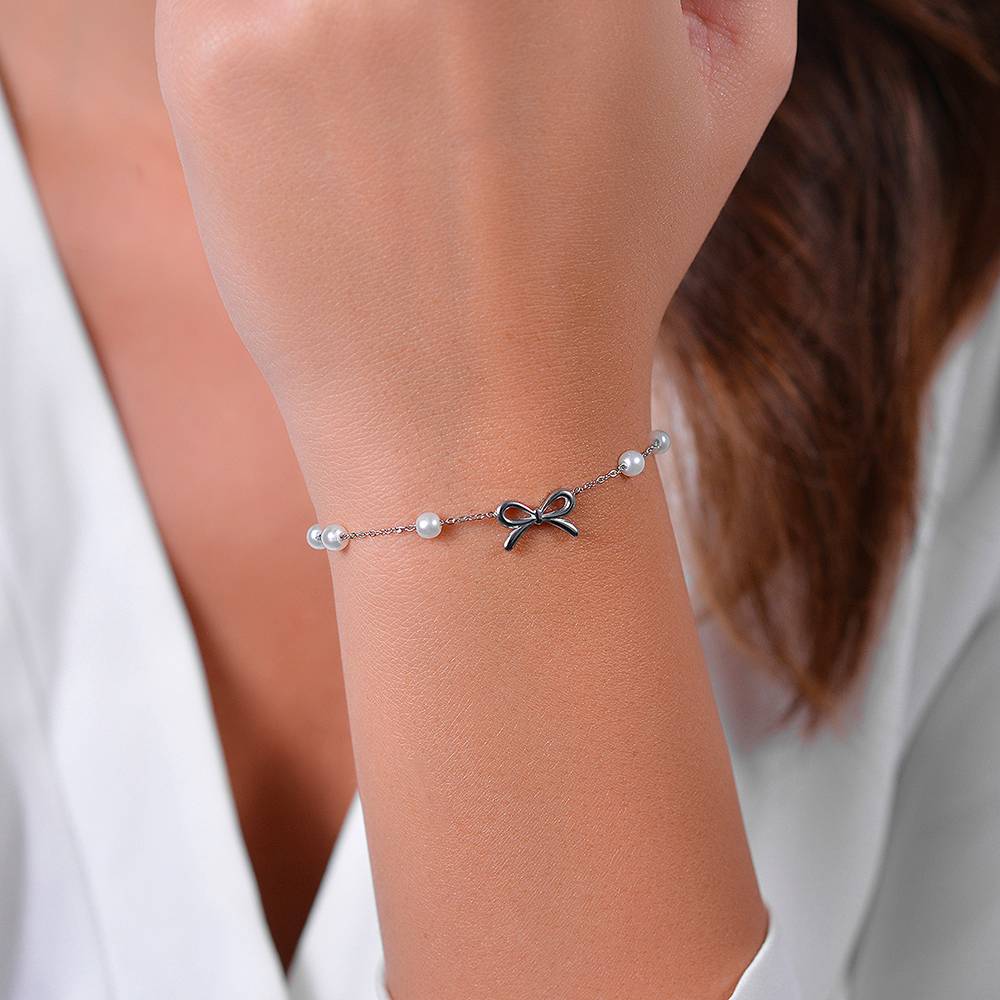 BRACCIALE DONNA IN ACCIAIO PERLE SINTETICHE E FIOCCO - Image 2